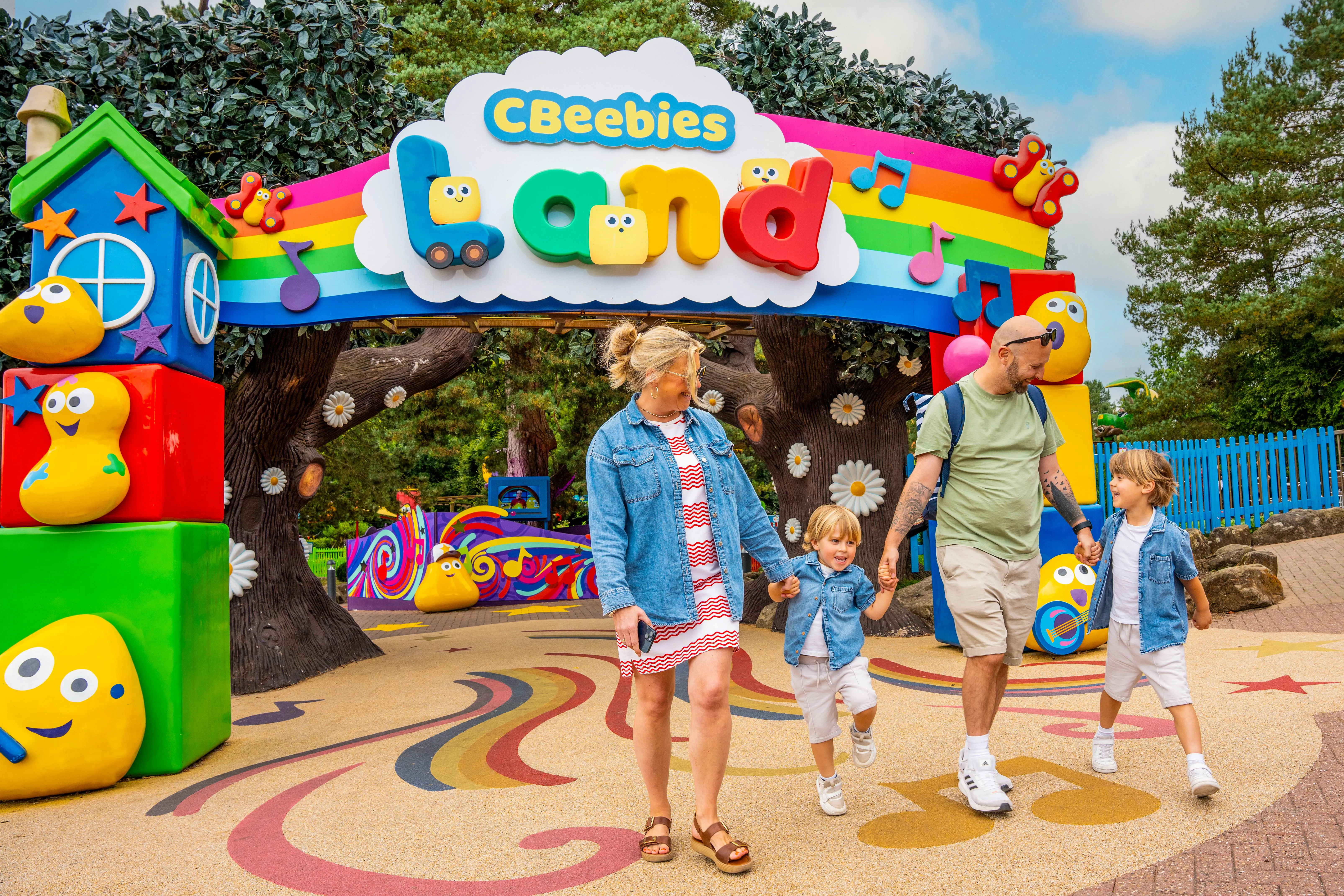 Family at the entrance of CBeebies Land at Alton Towers Resort