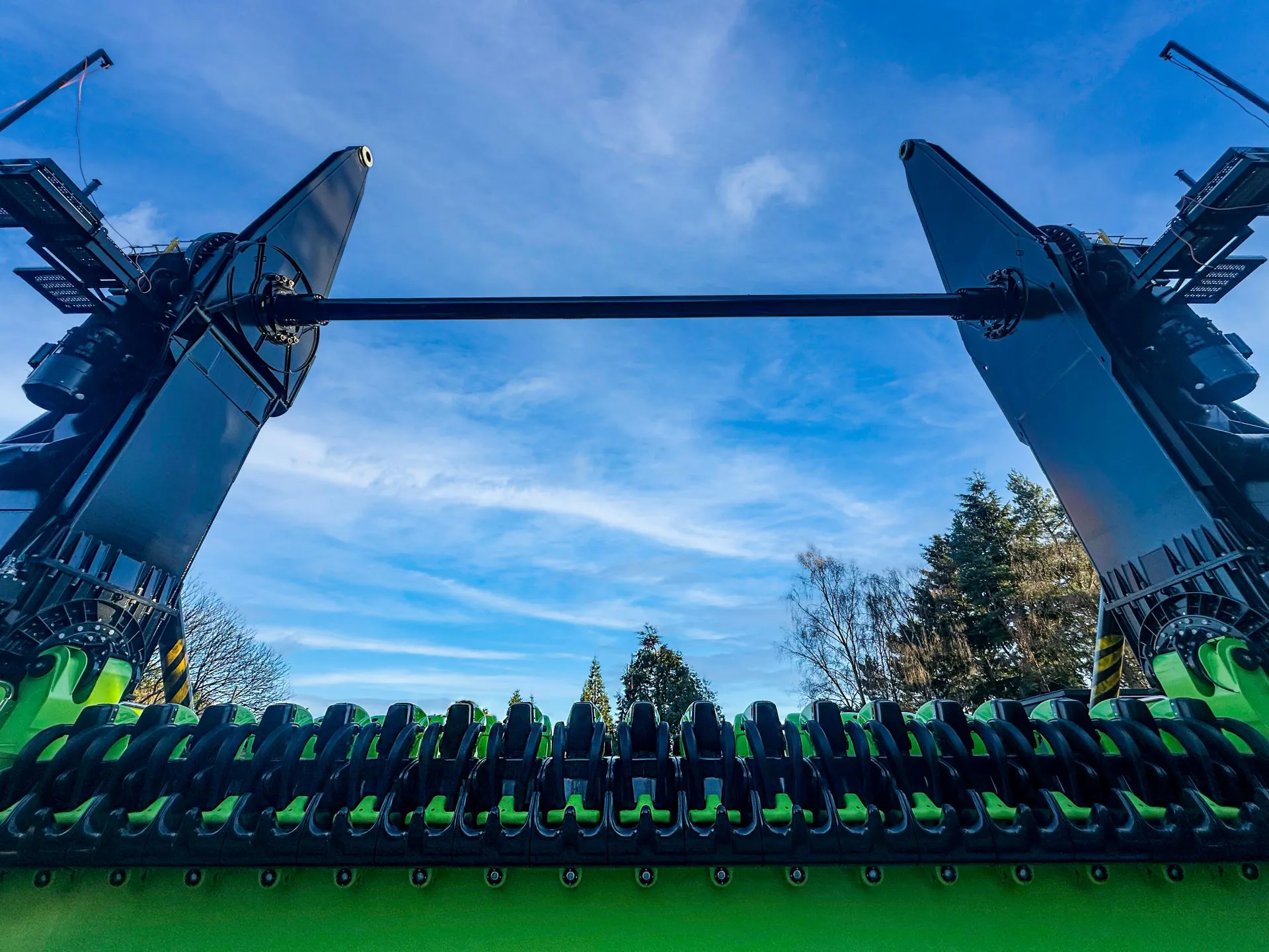 Alton Towers new ride, green and black seats with blue sky background 